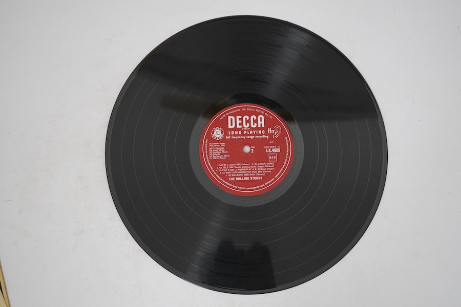 The Rolling Stones, first LP record album, on red Decca label, LK.4605, XARL-6271-1A XARL-6272-3A. Condition - fair to good, some surface scratches and general wear to the cover.